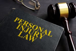 Personal Injury Law book and case file, Attorneys overlooking the Dog Bite case.